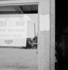 Sign on post office door: Farm animals and household equipment..., Vader, western Washington, 1939. Creator: Dorothea Lange