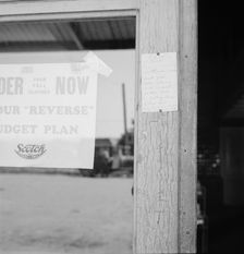 Sign on post office door: Farm animals and household equipment..., Vader, western Washington, 1939. Creator: Dorothea Lange