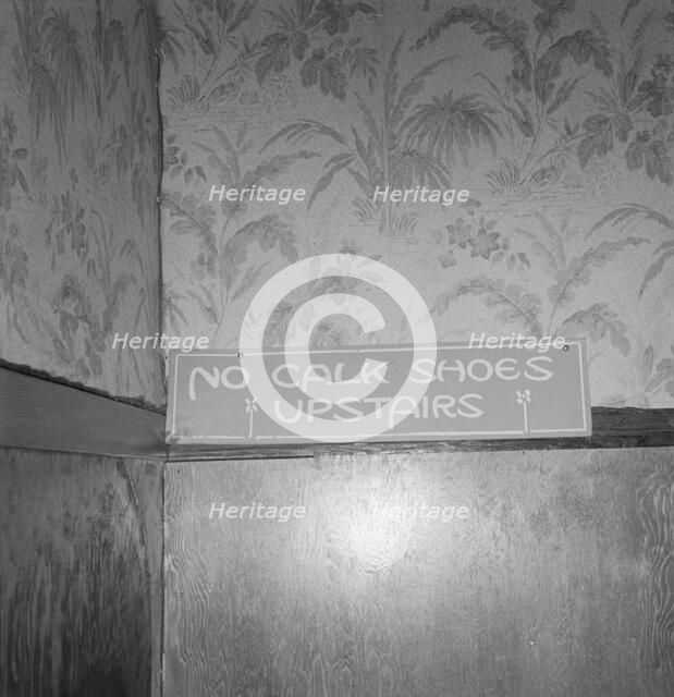 Sign on staircase on Brooks Hotel in a town..., West Carlton, Yamhill County, Oregon, 1939. Creator: Dorothea Lange.