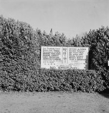 Sign outside entrance of largest lumber mill in the world, Longview, Washington, 1939. Creator: Dorothea Lange