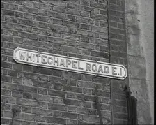 Sign Reading Whitechapel Road E.I. 1930s. Creator: British Pathe Ltd