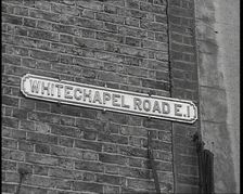 Sign Reading Whitechapel Road E.I. 1930s. Creator: British Pathe Ltd