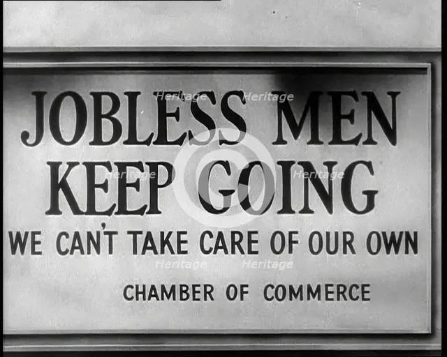Sign reads: 'Jobless Men Keep Going - We Can Take Care of Our Own - Chamber of Commerce', 1932. Creator: British Pathe Ltd.