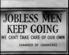 Sign reads: Jobless Men Keep Going - We Can Take Care of Our Own - Chamber of Commerce 1932. Creator: British Pathe Ltd