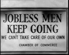 Sign reads: Jobless Men Keep Going - We Can Take Care of Our Own - Chamber of Commerce 1932. Creator: British Pathe Ltd