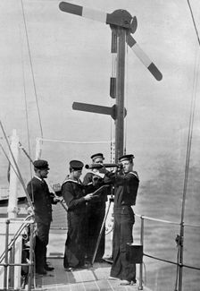 Signalling by semaphore on board HMS Camperdown 1895. Artist: Gregory & Co