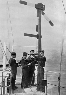 Signalling by semaphore on board HMS Camperdown 1895. Artist: Gregory & Co