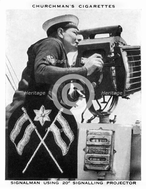 Signalman using 20 Signalling Projector, 1937.Artist: WA & AC Churchman