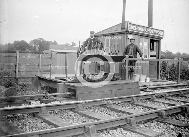 Signalmen pose outside a signal box near Grendon Underwood, Northamptonshire, c1872-c1923. Artist: Alfred Newton & Sons