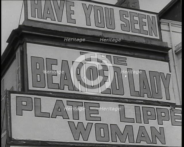 Signs at a Seaside Show 'HAVE YOU SEEN' 'THE BEARDED LADY' 'PLATE LIPPED WOMAN', 1938. Creator: British Pathe Ltd.