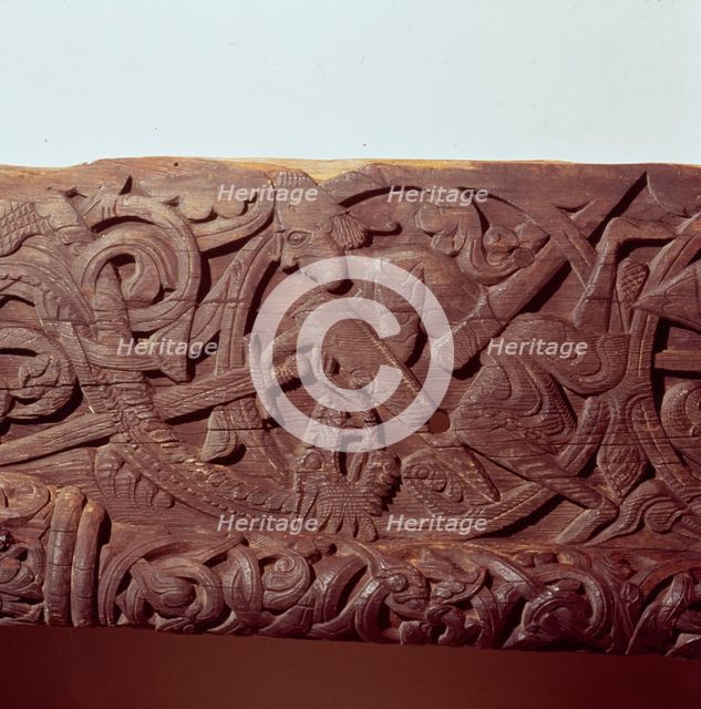 Sigurd kills the Dragon, Fafnir. Detail of wood panel of Hylestad Church, Norway.  Artist: Unknown.