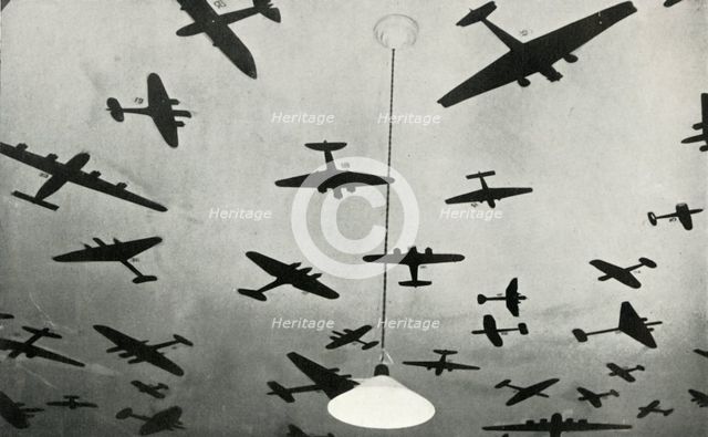 Silhouettes of military aircraft...at an RAF training school during the Second World War, 1941. Creator: Charles Brown.