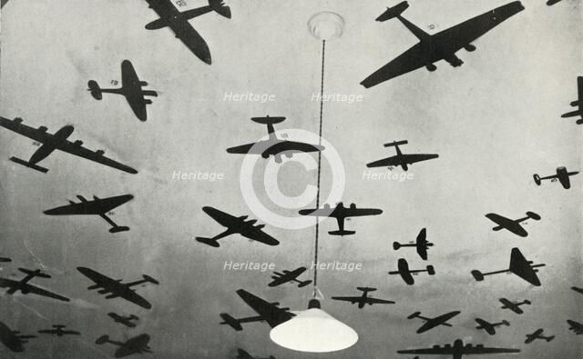 Silhouettes of military aircraft...at an RAF training school during the Second World War, 1941. Creator: Charles Brown.