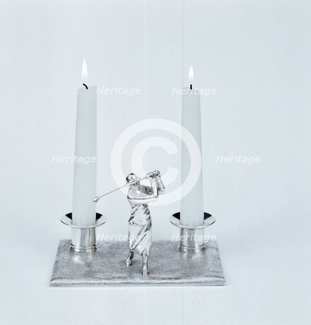 Silver candleholder with female golfer figure, 1930s. Creator: Unknown.
