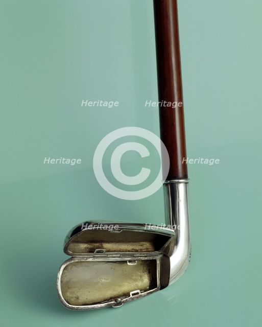 Silver cigarette case walking stick designed to look like a golf club, c1910. Creator: Unknown.