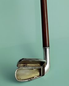 Silver cigarette case walking stick designed to look like a golf club, c1910. Creator: Unknown