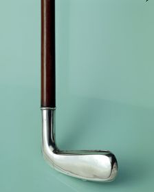 Silver cigarette case walking stick designed to look like a golf club, c1910. Creator: Unknown