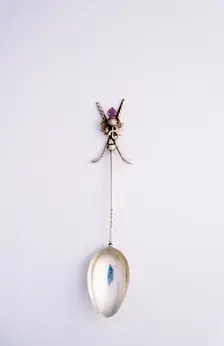 Silver spoon with crossed golf club motif, British, c1920s. Creator: Unknown