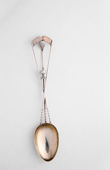 Silver spoon with crossed golf clubs and ball, c1920s. Creator: Unknown