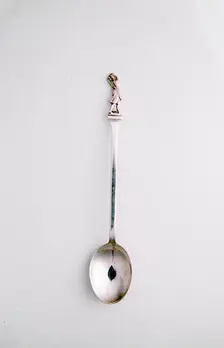 Silver spoon with golfing theme, c1910. Creator: Unknown