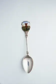 Silver spoon with enamelled shield with golfing theme, London, 1918. Creator: Unknown
