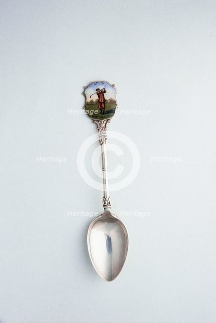 Silver spoon with enamelled shield with golfing theme, London, 1918. Creator: Unknown.