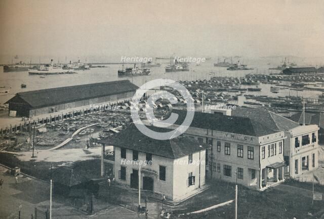 'Singapore Harbour is always crowded with shipping of many type and nationalities', 1937. Artist: Unknown.