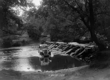 Singer 9 coupe competing in the Mid Surrey AC Barnstaple Trial, Tarr Steps, Exmoor, 1934. Artist: Bill Brunell