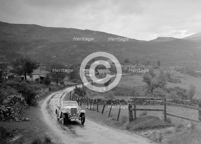 Singer Nine Sports of Miss MC Sherer competing in the RSAC Scottish Rally, 1936. Artist: Bill Brunell.