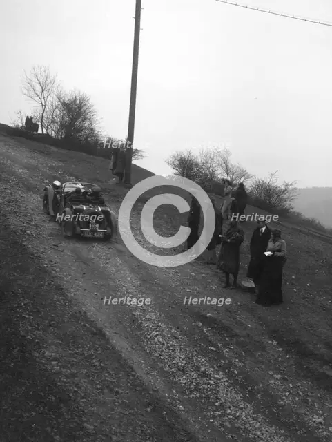 Singer of CV Glass climbing Nailsworth Ladder, Sunbac Colmore Trial, Gloucestershire, 1934. Artist: Bill Brunell.