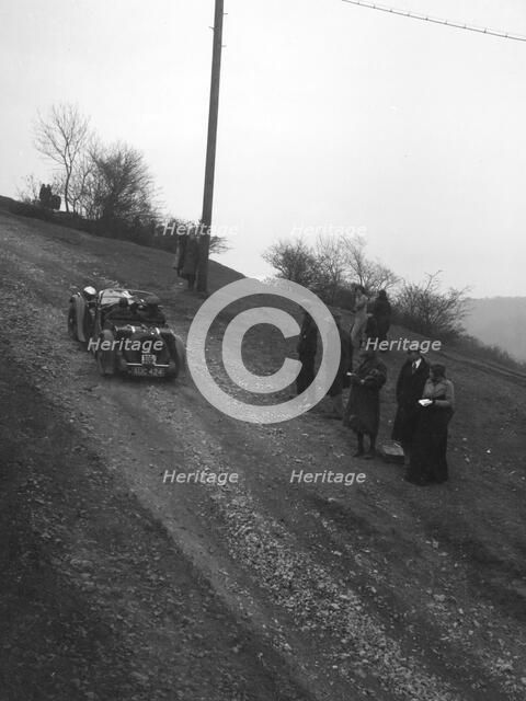Singer of CV Glass climbing Nailsworth Ladder, Sunbac Colmore Trial, Gloucestershire, 1934. Artist: Bill Brunell.