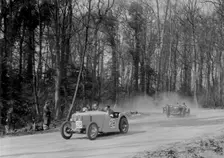Singer of JR Baker leading a Riley at Coppice Corner, Donington Park, Leicestershire, 1933. Artist: Bill Brunell