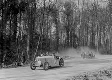 Singer of JR Baker leading a Riley at Coppice Corner, Donington Park, Leicestershire, 1933. Artist: Bill Brunell