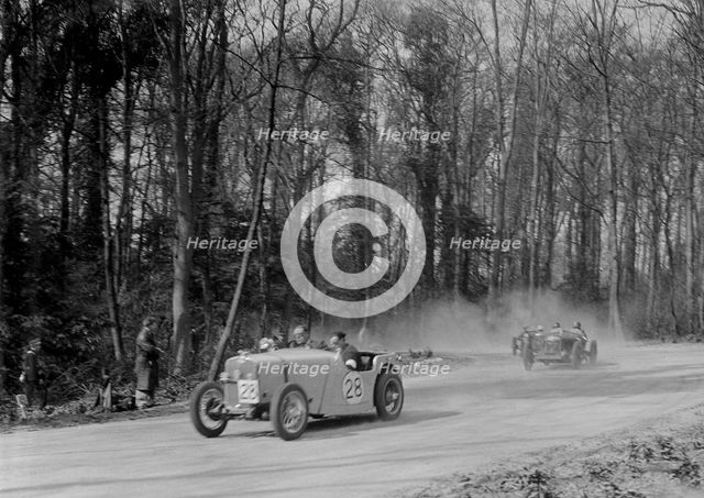 Singer of JR Baker leading a Riley at Coppice Corner, Donington Park, Leicestershire, 1933. Artist: Bill Brunell.