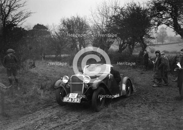 Singer of L Sandford at the Sunbac Colmore Trial, near Winchcombe, Gloucestershire, 1934. Artist: Bill Brunell.