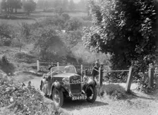 Singer open 2-seater taking part in a West Hants Light Car Club Trial, Ibberton Hill, Dorset, 1930s. Artist: Bill Brunell