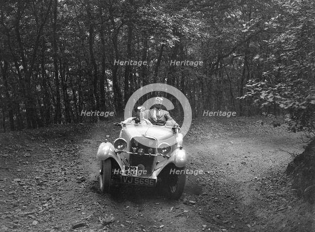 Singer competing in the B&HMC Brighton-Beer Trial, Fingle Bridge Hill, Devon, 1934. Artist: Bill Brunell.