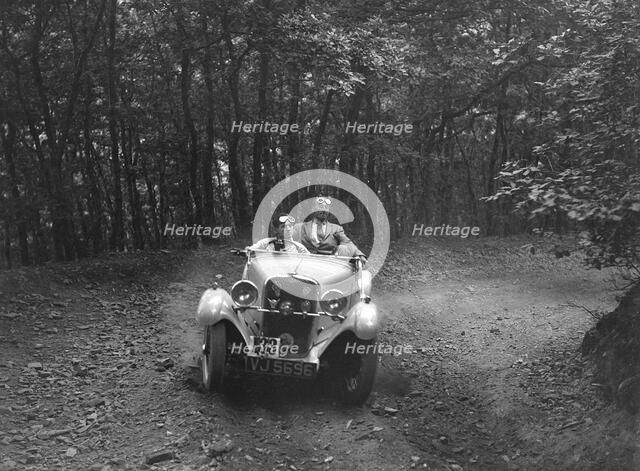 Singer competing in the B&HMC Brighton-Beer Trial, Fingle Bridge Hill, Devon, 1934. Artist: Bill Brunell.