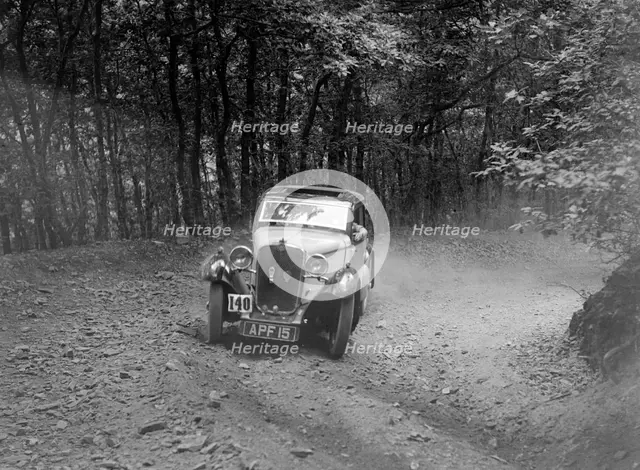 Singer coupe competing in the B&HMC Brighton-Beer Trial, Fingle Bridge Hill, Devon, 1934. Artist: Bill Brunell.