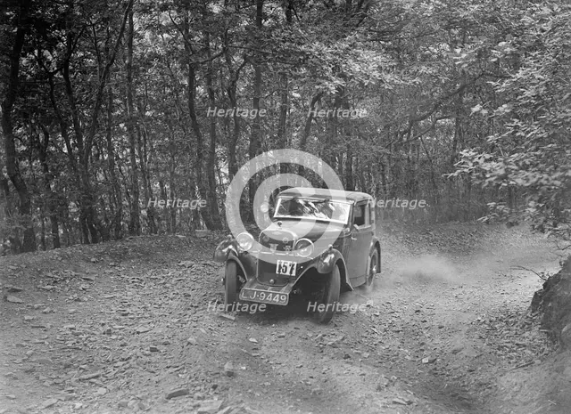 Singer coupe competing in the B&HMC Brighton-Beer Trial, Fingle Bridge Hill, Devon, 1934. Artist: Bill Brunell.
