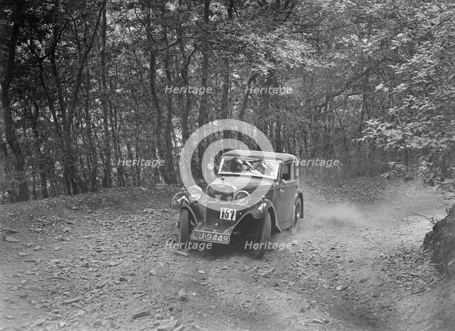 Singer coupe competing in the B&HMC Brighton-Beer Trial, Fingle Bridge Hill, Devon, 1934. Artist: Bill Brunell.