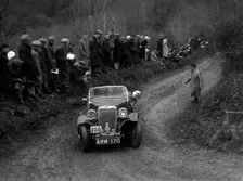 Singer Le Mans of J Eason-Gibson competing in the MCC Lands End Trial, 1935. Artist: Bill Brunell