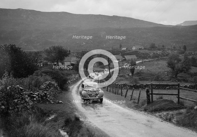 Singer Le Mans of WJB Richardson and SS Jaguar saloon of W Hetherington, RSAC Scottish Rally, 1936. Artist: Bill Brunell.