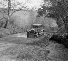 Singer Super Six driving through a ford at Croydon Hill, near Timberscombe, Somerset, 1930s Artist: Bill Brunell