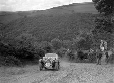 Singer sports competing in the Mid Surrey AC Barnstaple Trial, Beggars Roost, Devon, 1934. Artist: Bill Brunell