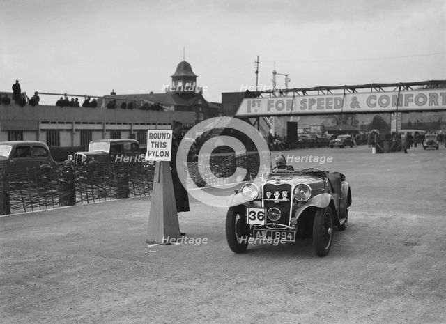 Singer sports competing in the JCC Rally, Brooklands, Surrey, 1939. Artist: Bill Brunell.