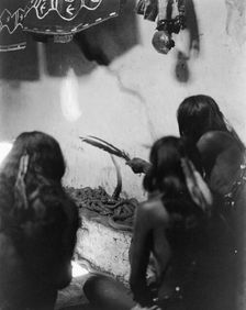 Singing to the snakes, Shipolovi, c1906. Creator: Edward Sheriff Curtis
