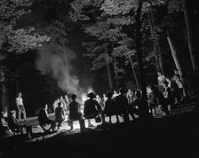 Singing around the camp fire at Camp Nathan Hale, Southfields, New York, 1943 Creator: Gordon Parks