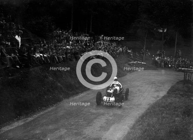 Single-seater MG R type competing in the Shelsley Walsh Hillclimb, Worcestershire, 1935. Artist: Bill Brunell.