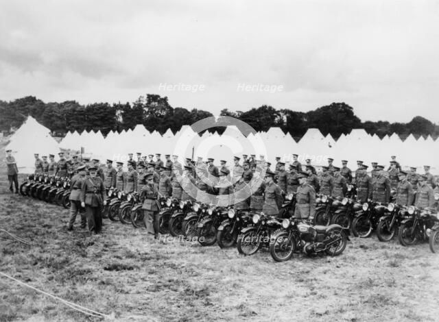 Sir Malcolm Campbell inspecting Territorial Army motorcycle reservists, c1938. Artist: Unknown